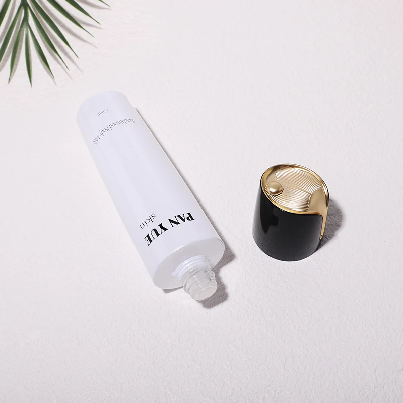 The latest lotus shaped empty glass bottle set with plastic plating lid for cosmetics skincare packaging wholesales