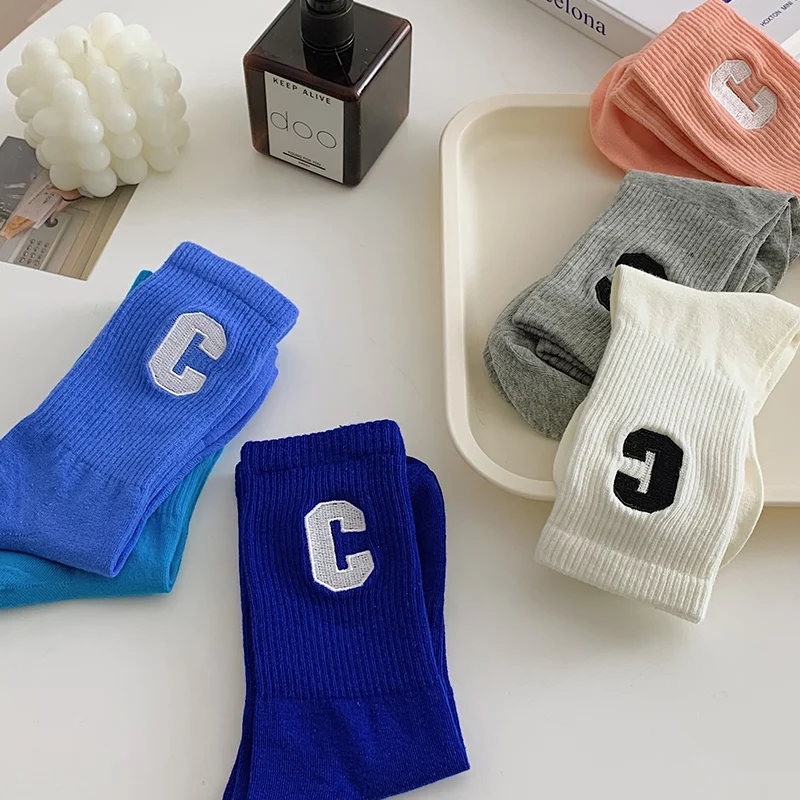 Manufacturer hot sale fashion trend letter Klein blue socks mid-calf length cotton teens socks
