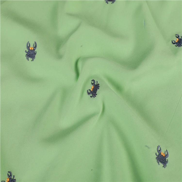 
100% polyester 75D*150D twill microfiber peach skin embroidered beach shorts fabric 