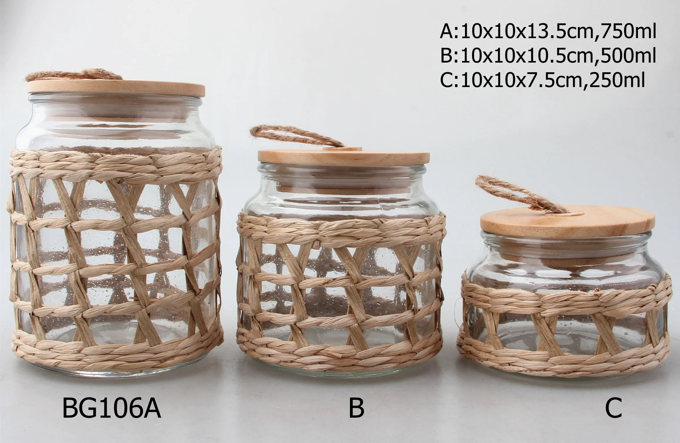 New design hot sale glass food storage jar and canister with hemp rope wooden lid and grass straw coating for kitchen home decor