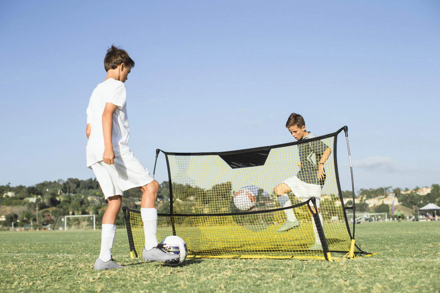 two sides yellow soccer rebounder two people can use Simultaneously