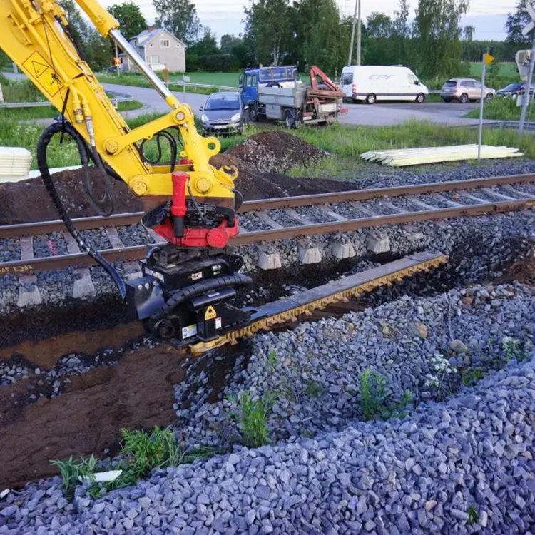 railway excavator with ballast undercutter removes fouled ballast from underneath the railway track