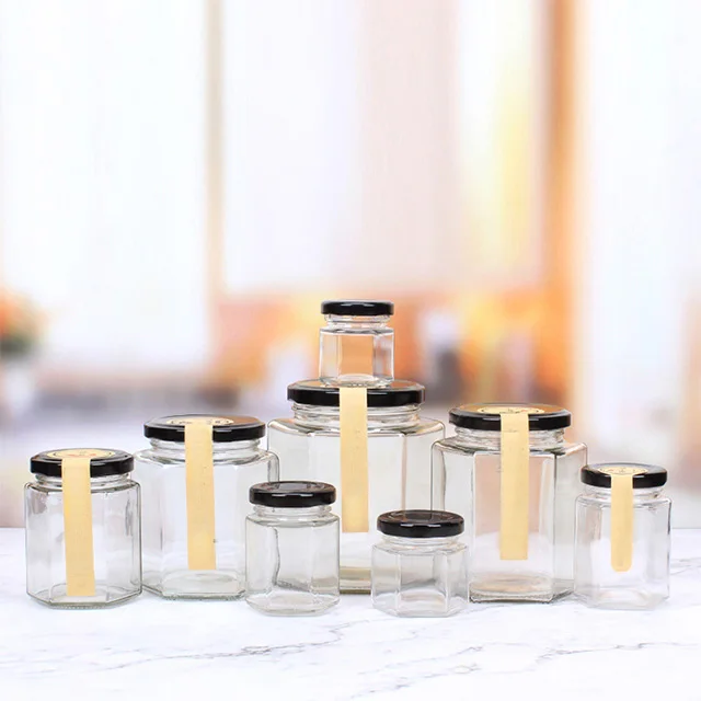 PUTIAN Factory Wholesale Glass Hexagon Jar Honey Bottles With Metal Lid for Kitchen Food Container