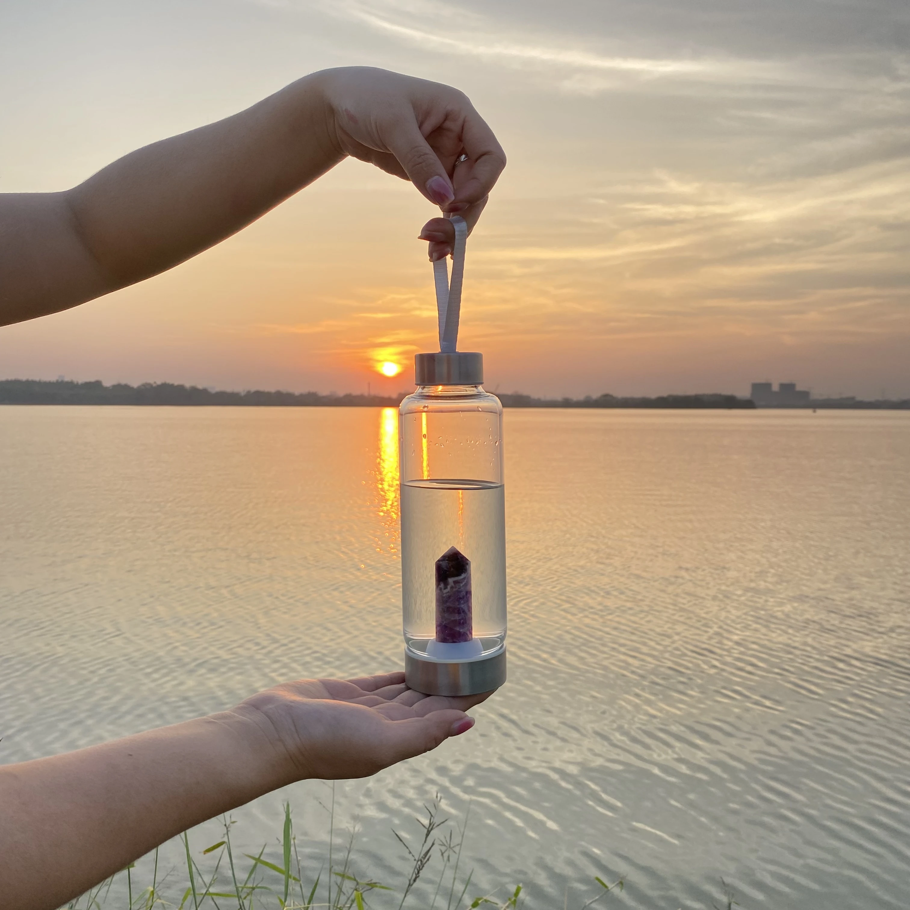Glass Water Bottle With Rose Quartz Crystal on the Bottom