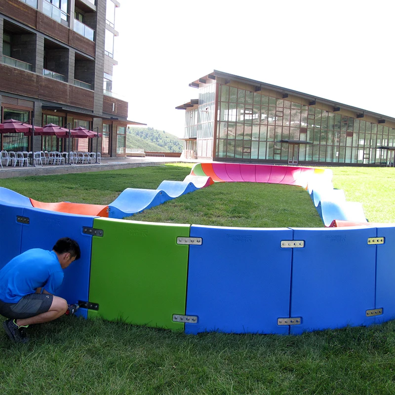 Plastic modular pump track velocity loop 2 is a sequence of roll overs  and berms  for bikes, BMX scooters and skateboards
