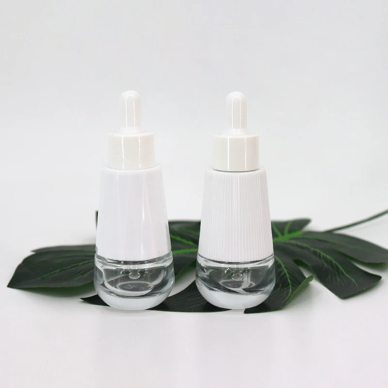 Wholesale 30ml Cosmetics Packing Taper Essential Oil Clear Glass Dropper Bottle With Plastic Outer Cover For Face Essence Serum