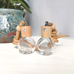 Avertan wholesale 8ml Round shape  High Car Diffuser Perfume Glass Bottle With Hanging Ropes