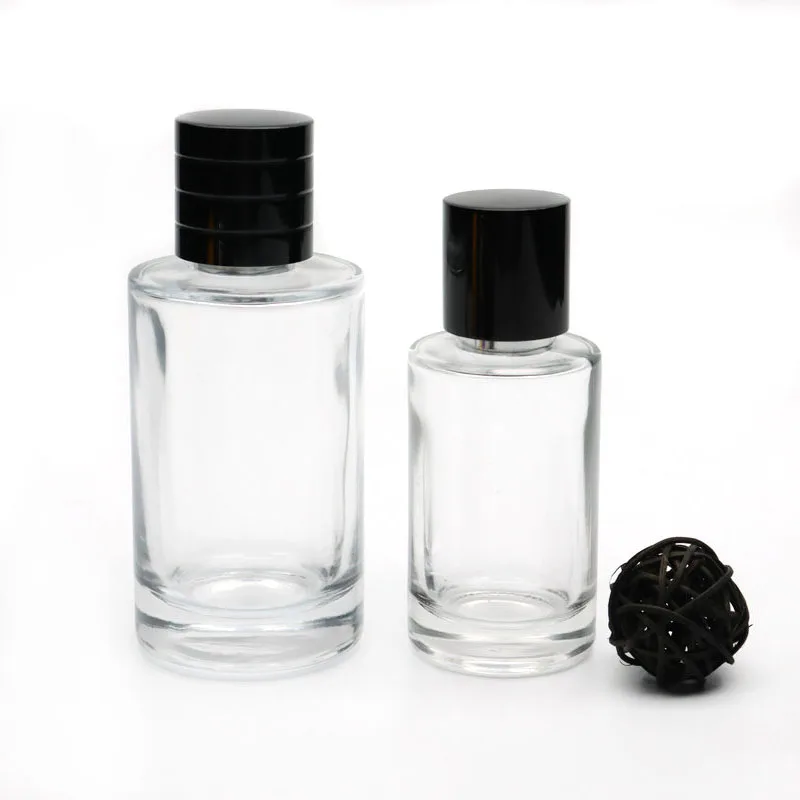 Wholesale crimp top 50ml 100ml Cylinder perfume empty spray glass bottle with nonmagnetic / magnetic black cap