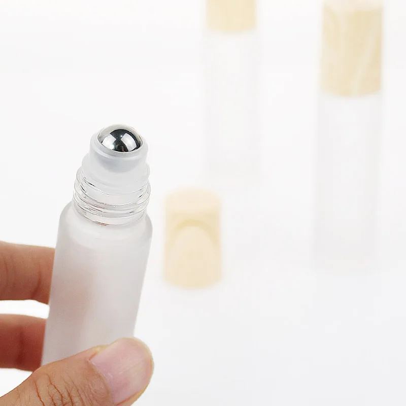 10ml Empty Frosted Clear Glass Roller Bottles With Wood Grain Lid Matte Roll on Bottle for Essential Oil