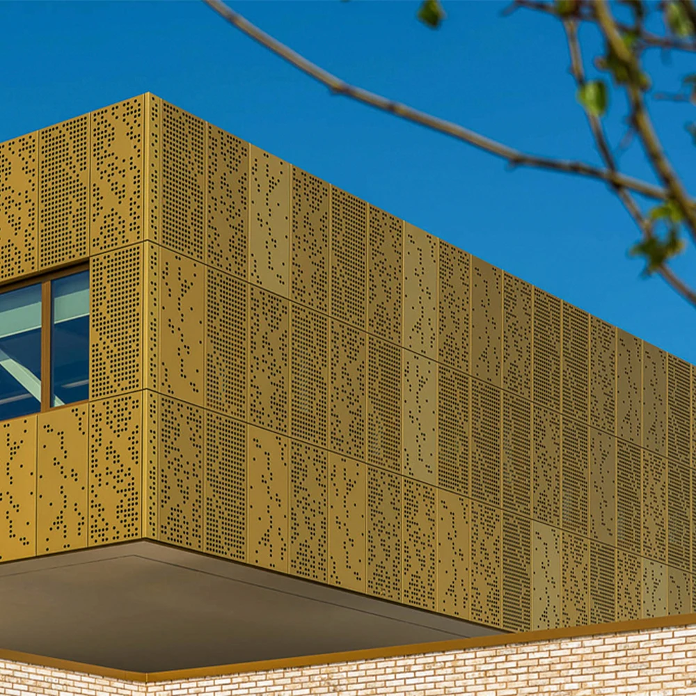 Perforated metal cladding for commercial building exterior facades