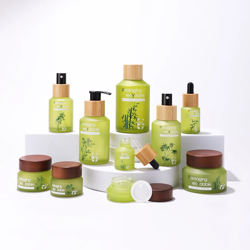 Fancy label frosted green glass bottle jar for face scream skin care lotion products with bamboo wooden lid bottle manufacturing