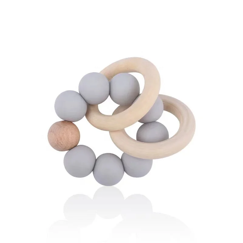 INS hot selling New Design Sensory Baby Teething Toys Rattle Soft Wood Baby Teether Ring Kids Food Grade Silicone Teether