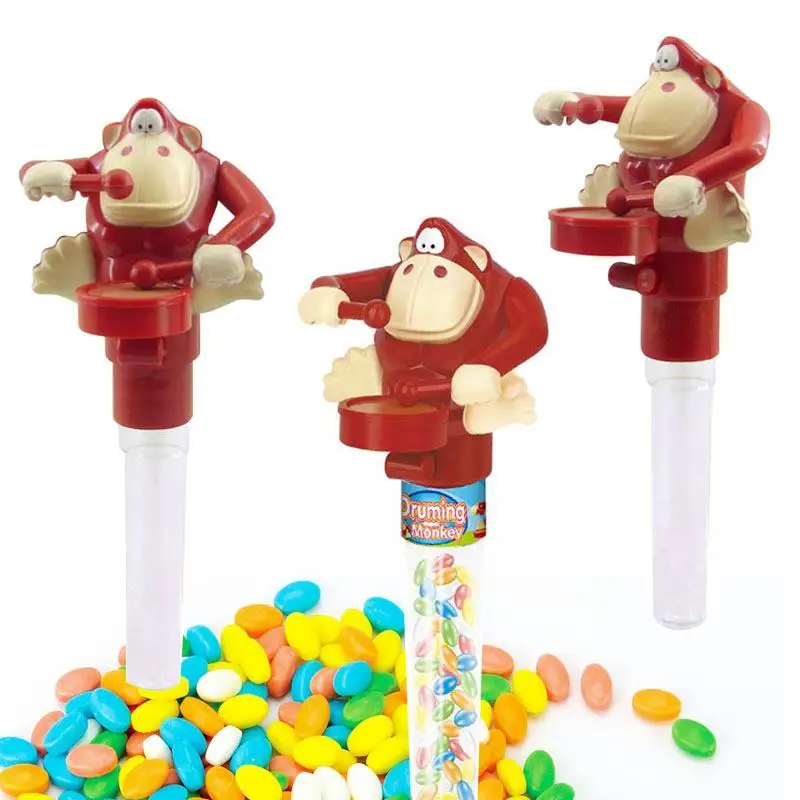 Popular wholesale plastic drumming monkey candy toys across many nations perfect for food and snack stores and retail outlets