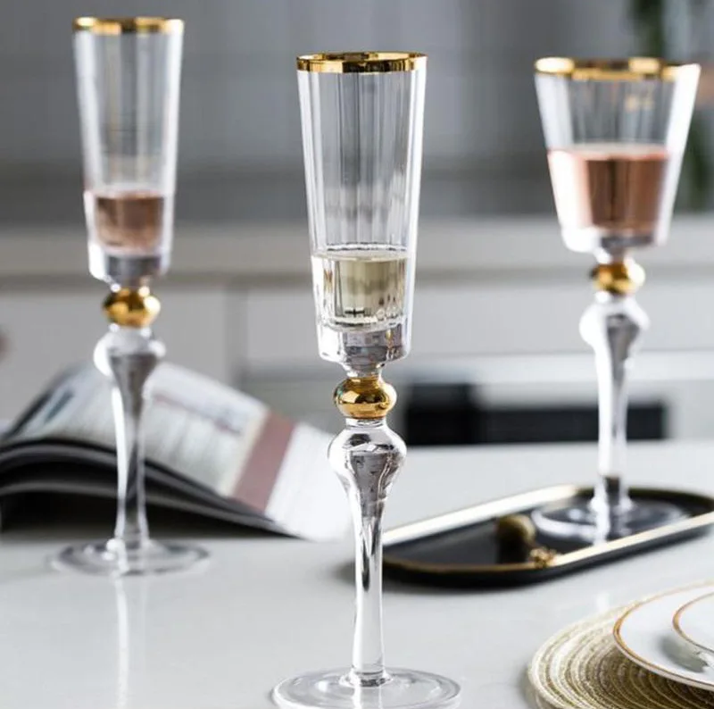 Crystal high ending hand made wine and champagne glasses with pattern design and golden rim and stem daily production items