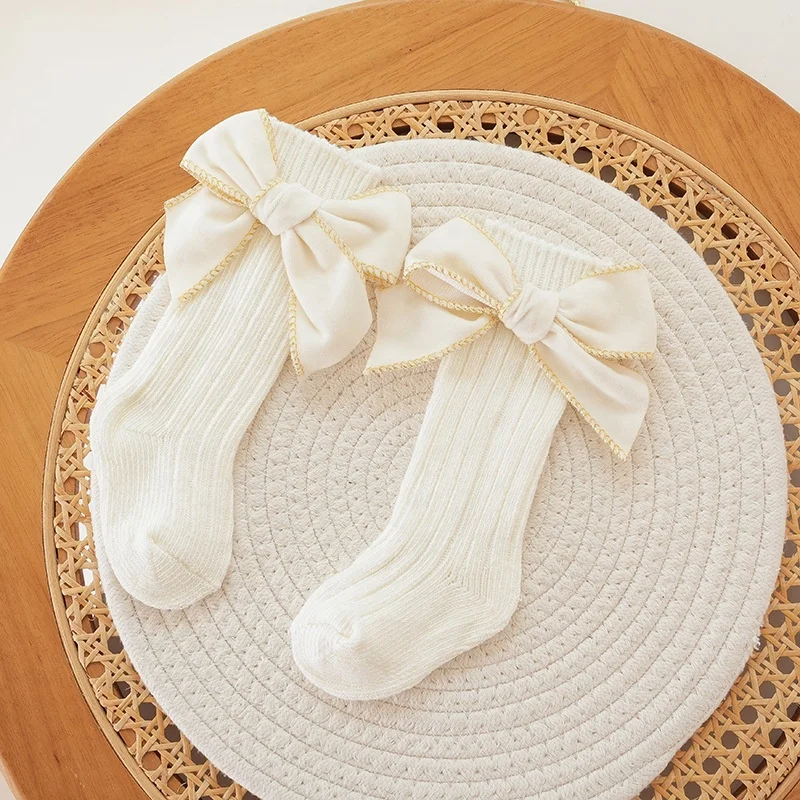 Autumn and winter baby girl fashion thick needle cotton socks solid color sweet bow princess style high socks