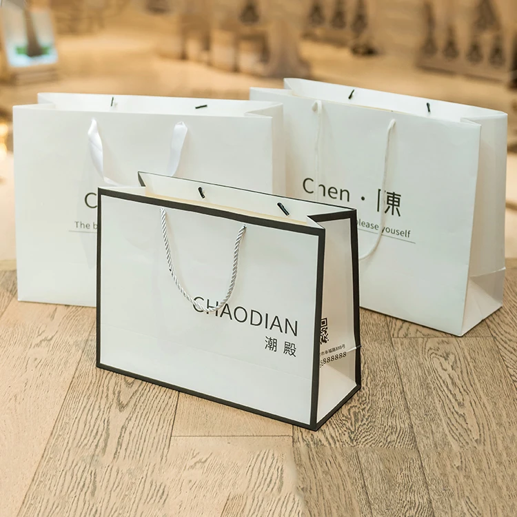 Personalized Clothing Luxury Branded Retail Packaging For Boutique Custom Logo Gold Silver Paper Bag For Clothing Packaging
