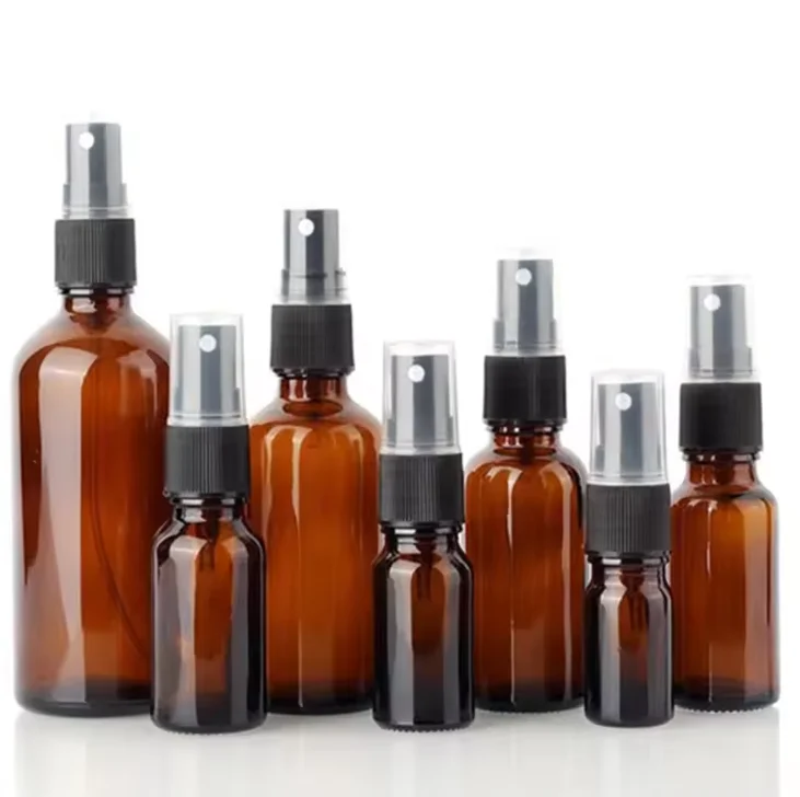 Wholesale 30ml 50ml 100ml amber glass spray bottle empty essential oil glass bottle with plastic atomizer pump