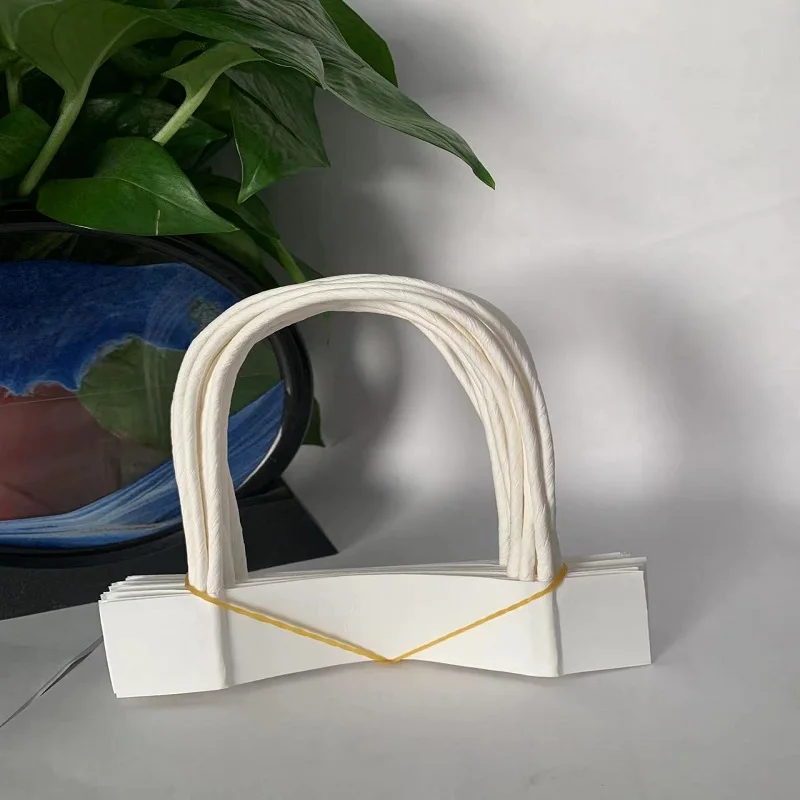 Twisted handle for bulk shopping paper bags used to make bags