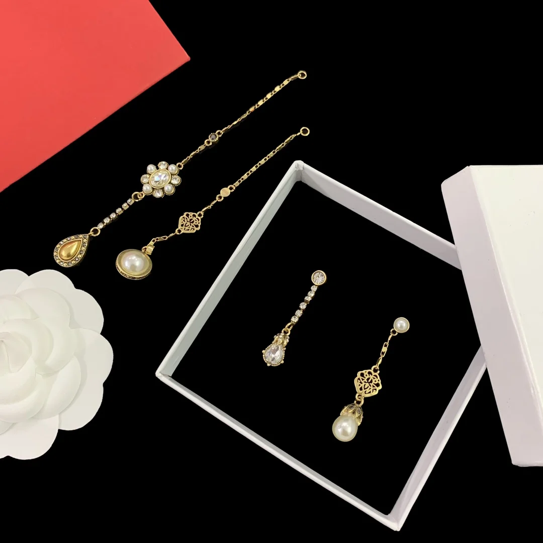 Alexander McQueens Cross border factory 925 silver  long and short tassel pearl studded earrings holiday high-value accessories