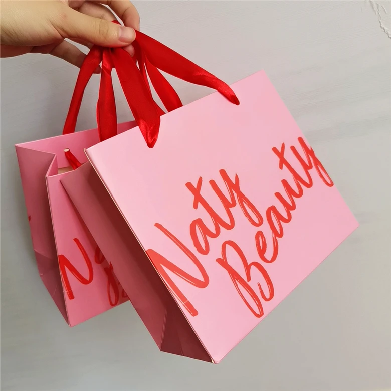 Hot Sale Customized logo Clothing paper bag with handle Luxury Custom paper gift bags with logo printing