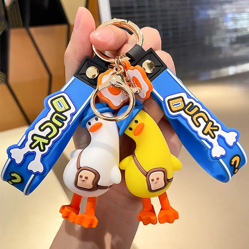 Funny tilt head duck cute anime pvc 3d keychain custom logo pvc rubber keychain Key Handbag Accessories