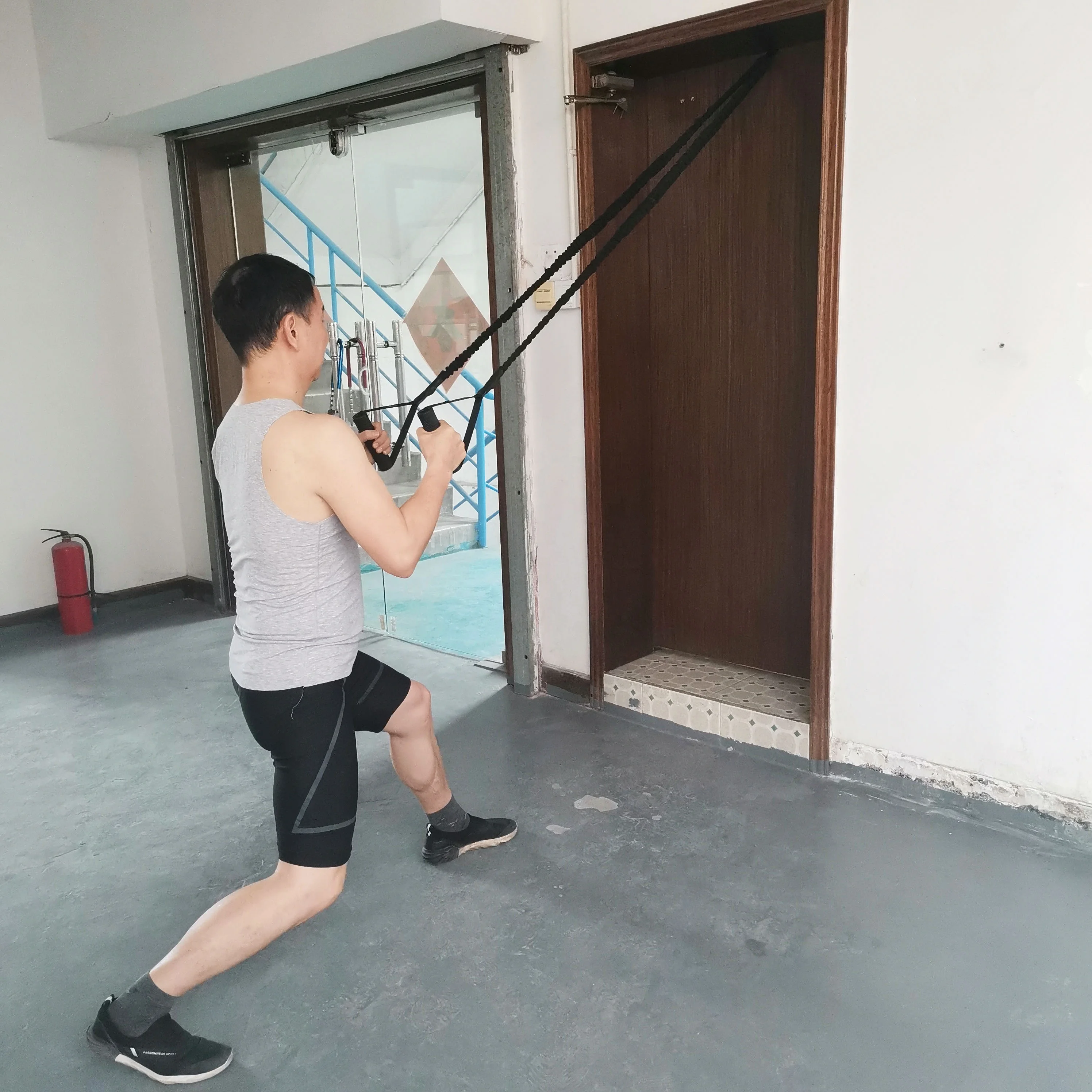 Protective Nylon Sleeve Resistance Band with Handle Grip for Bodybuilding