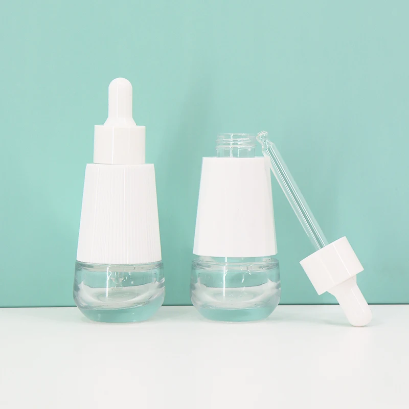 Wholesale 30ml Cosmetics Packing Taper Essential Oil Clear Glass Dropper Bottle With Plastic Outer Cover For Face Essence Serum