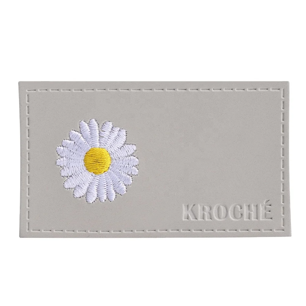 Embroidered leather label for clothing