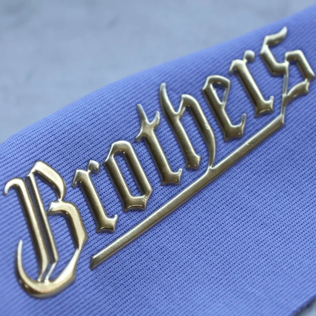 Custom High Quality Golden TPU Heat Transfer Sticker Soft 3D Embossed Patches Badges for Garments