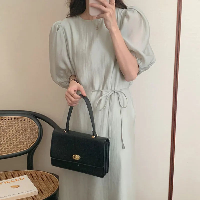 Wholesale 2023 South Korea Soft Green Round Neck Hollow-out Backless Lace Up Waist Solid Color Bubble Sleeve Dress