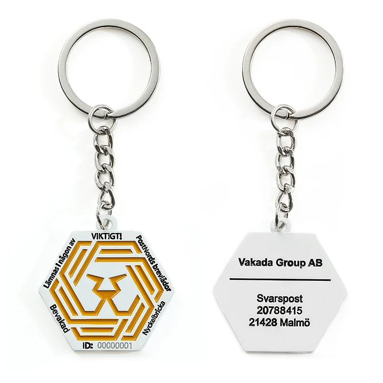 Брелок серебряного цвета с мягкой эмалью лазерной гравировкой