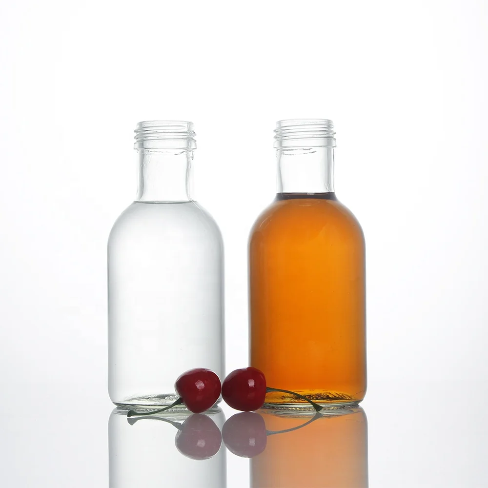 Stocked round clear empty 350ml glass bottle for beverage drinks 120oz fruit juice glass bottle