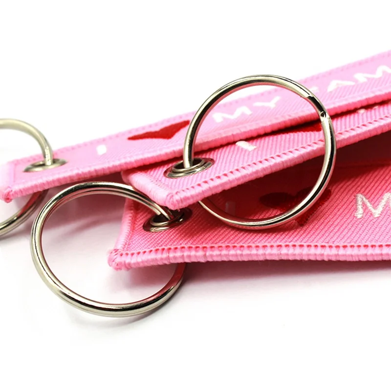 Facility wholesale pink fabric keychain embroidery with remove before kiss key ring custom
