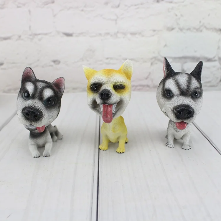 Cute doll simulation resin spring shake head dog car interior decoration lucky pet dog