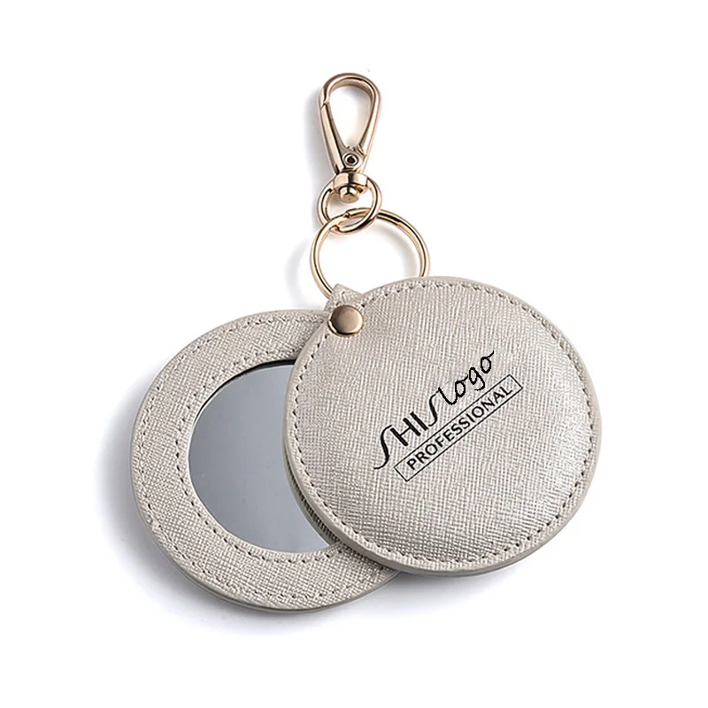 CCustom Logo PU Leather Heart Shape Cute Small Portable Mini Cosmetic Compact Pocket Mirror Keychain Mirror For Makeup