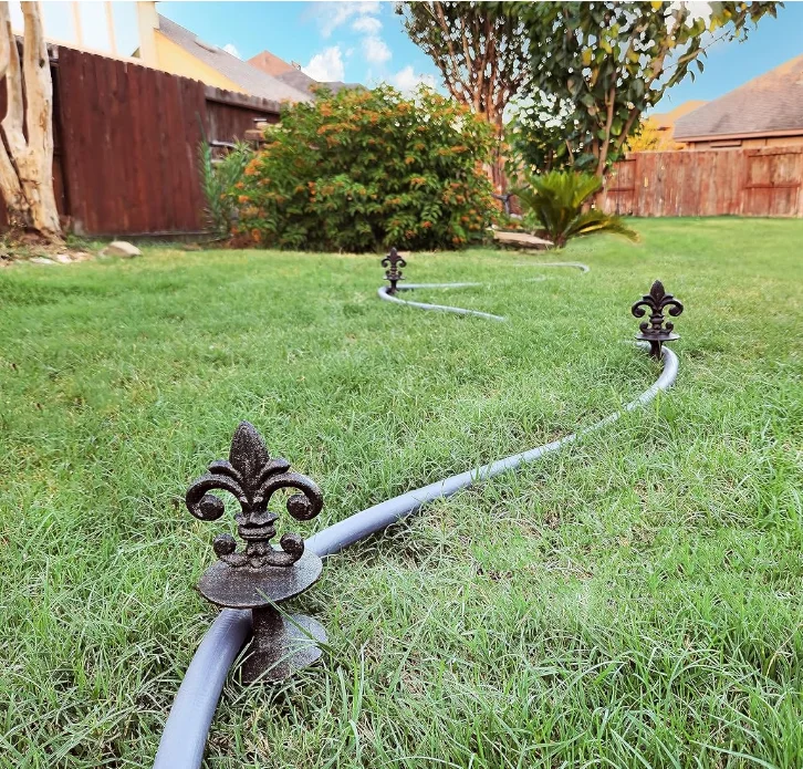 Antique Black Cast Iron Garden Strong and Decorative Hose Guide that Protects Your Plants and Provides Elegance to Your Garden