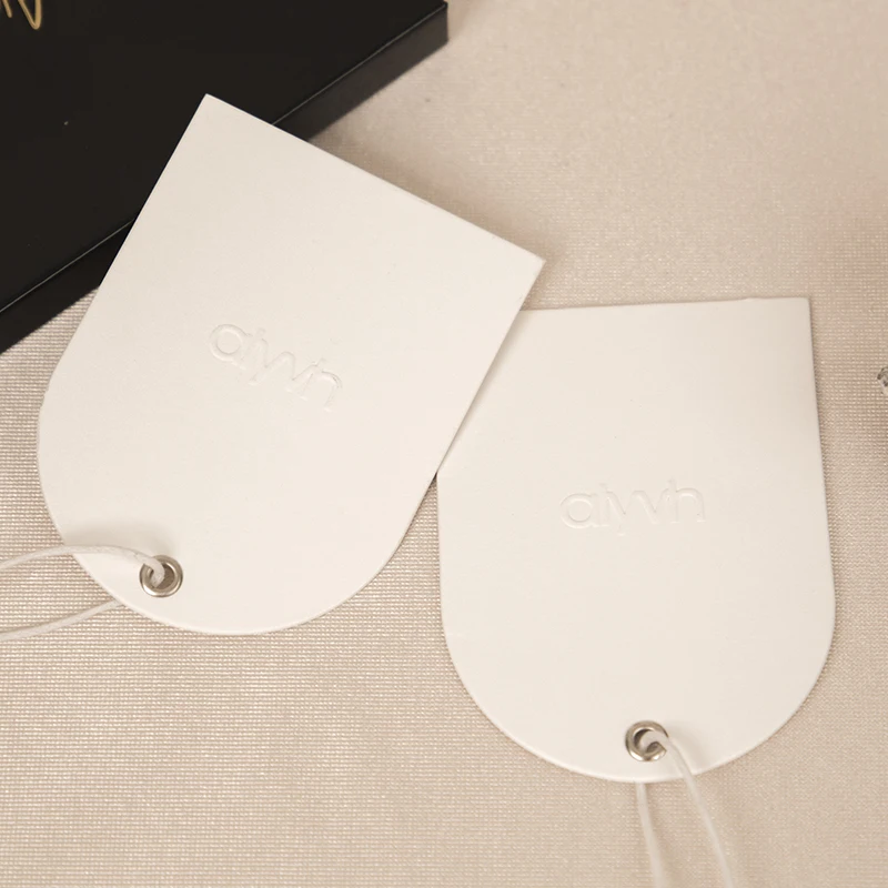 custom embossed logo metal eyelet hangtag paper swing tag arch shape tag with string