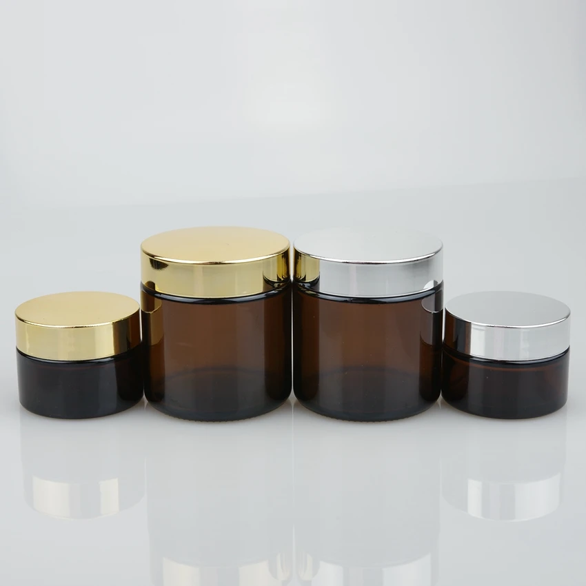 OEM 20ml 30ml 50ml 100ml clear amber cosmetic cream glass jar with gold and silver lid
