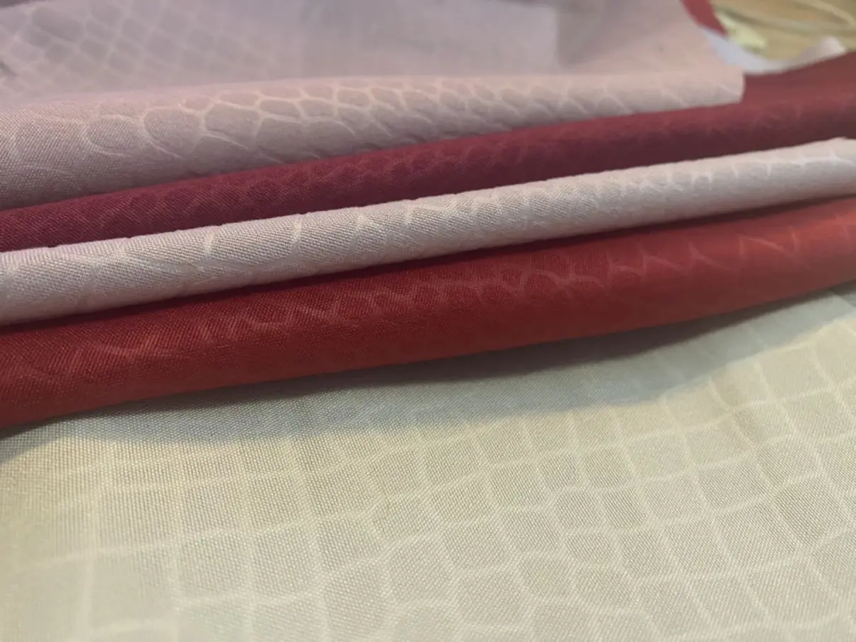 Wholesale 100% polyester stretch knit Dyed Embossed cheap embossed printed fabric for garments