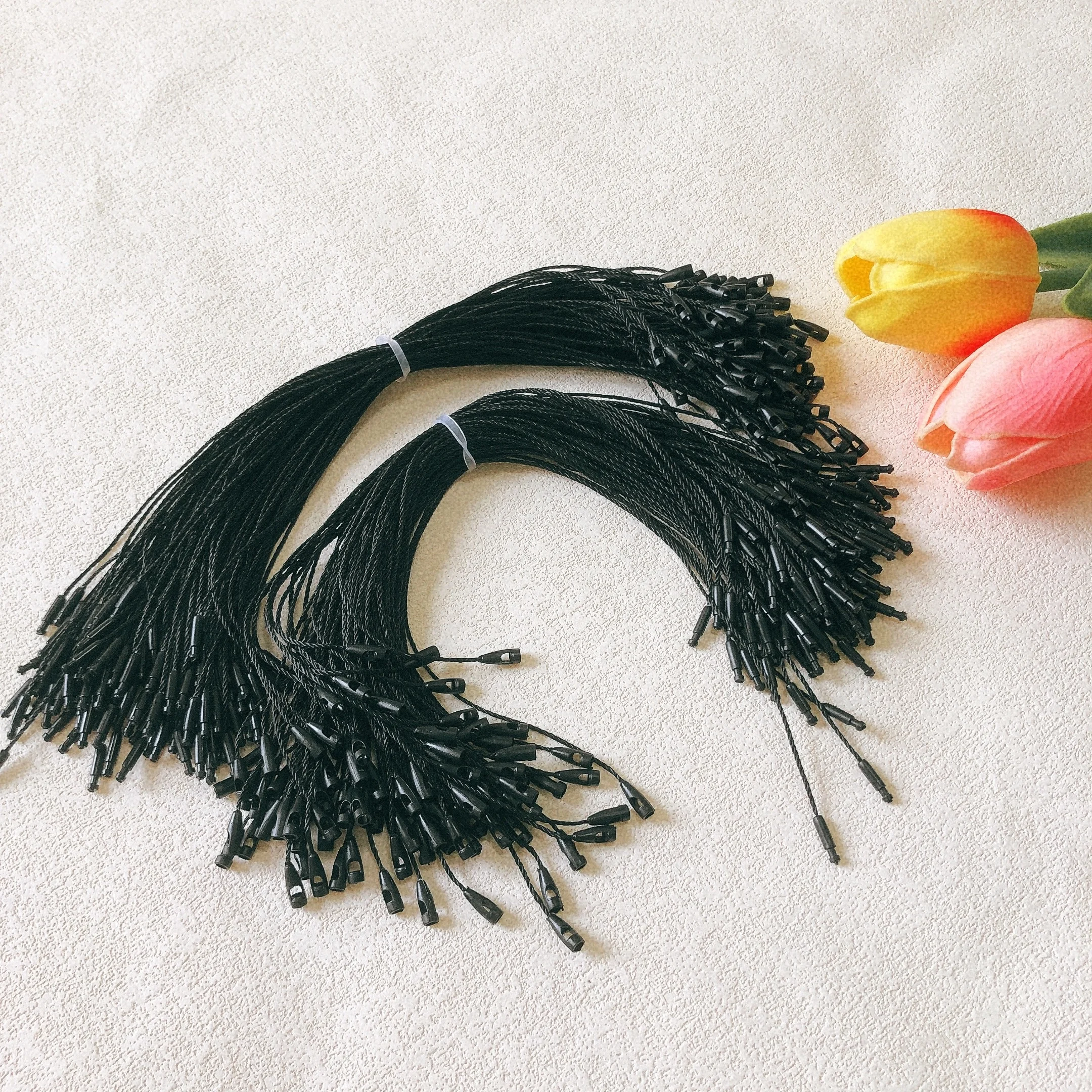 Clothing accessory polyester biodegradable hangtag BulletHead black string knotting