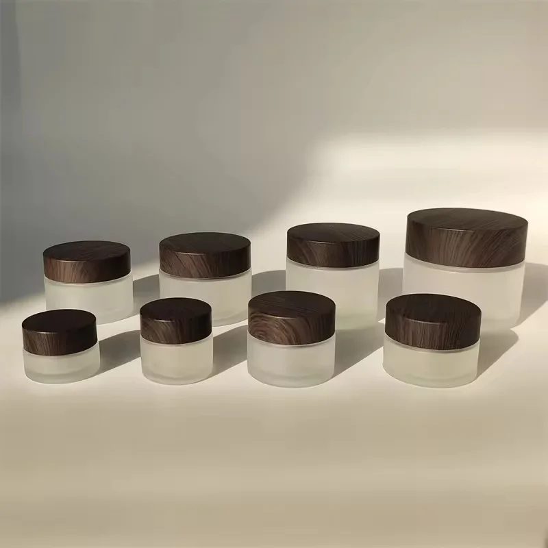 Wholesale 20g 30g 50g 80g 100g Cream Matte Black Glass Jar with New Wood Grain Cover Facial Cream Bottle