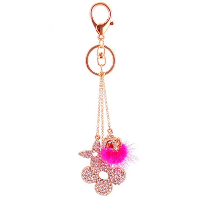 Charming design diamond hair ball four-leaf clover with fur ball car keychain ladies bag accessories keychain