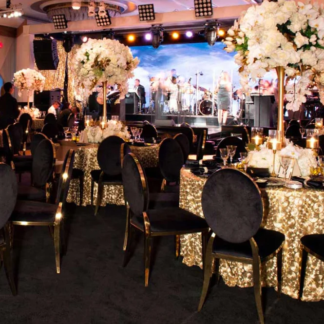 Оптовая продажа, штабелируемые прочные стулья из нержавеющей стали золотистого и черного цвета с круглой спинкой для банкетов, торжеств, свадеб