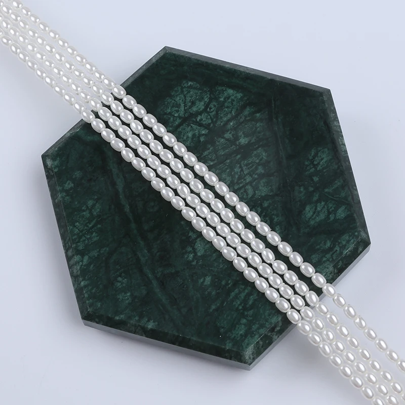 Zhuji Wholesale 3*4mm  Or 4*5mm Shell Of  Rice  Pearl Natural White Stands For Sale