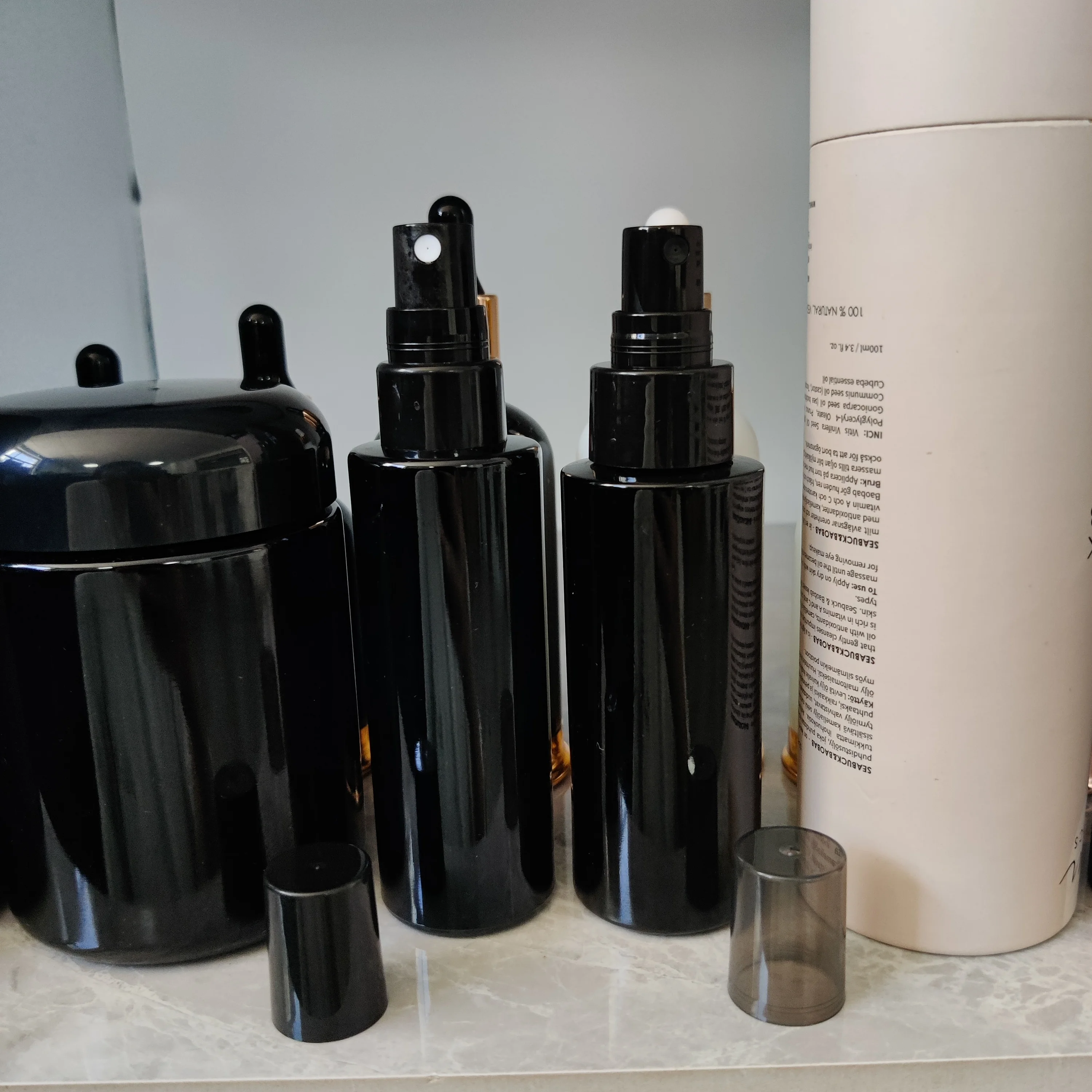 cosmetic packaging dark violet cylinder spray glass bottle