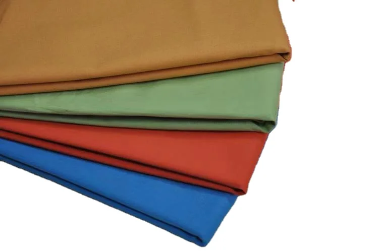qingdao  jinsuo trade cvc 65 35 polyester cotton twill fabric fabrics for clothing stock lot fabric good price