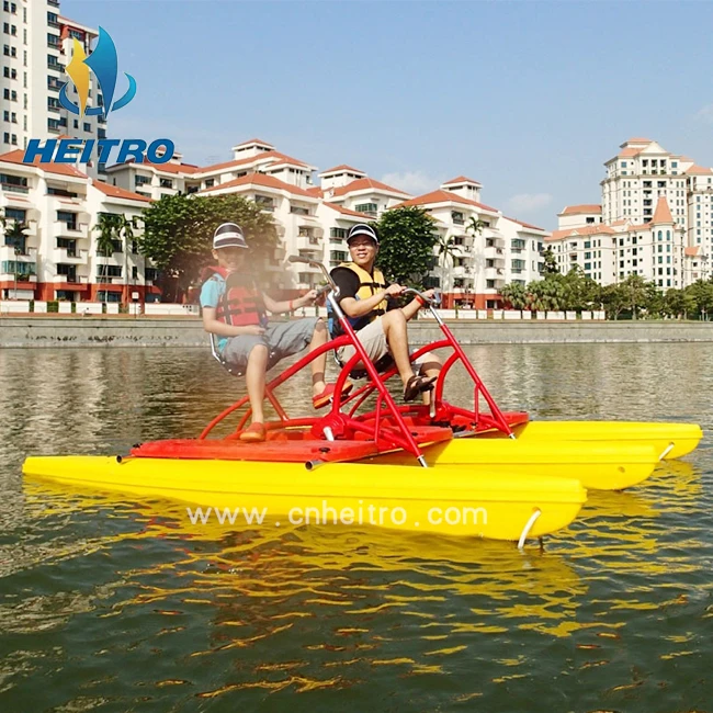 floating boat able to cycle on water mounted on two floats, recreational and competitive activity using water bike