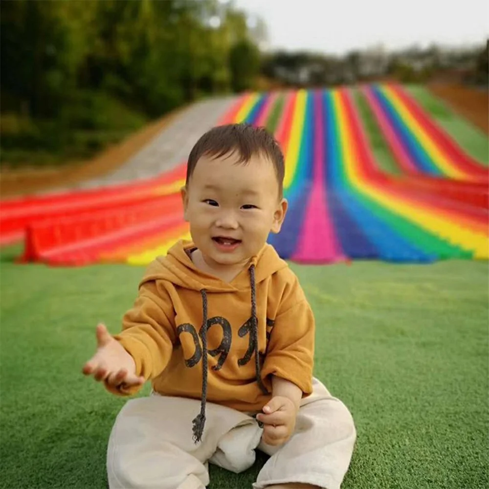 Commercial Rainbow Slide Artificial Ski Grass Turf Surface Donut Slide Ride Dry Slide Slope For Adult