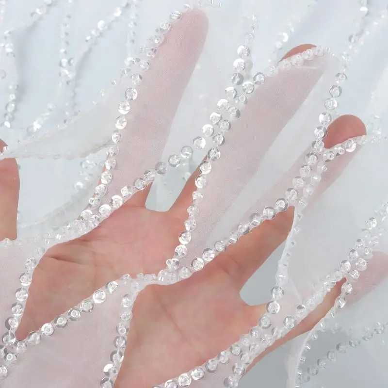 2023 wholesale price luxury crystal bridal fabric white mesh lace beaded sequin embroidery fabric for wedding dress