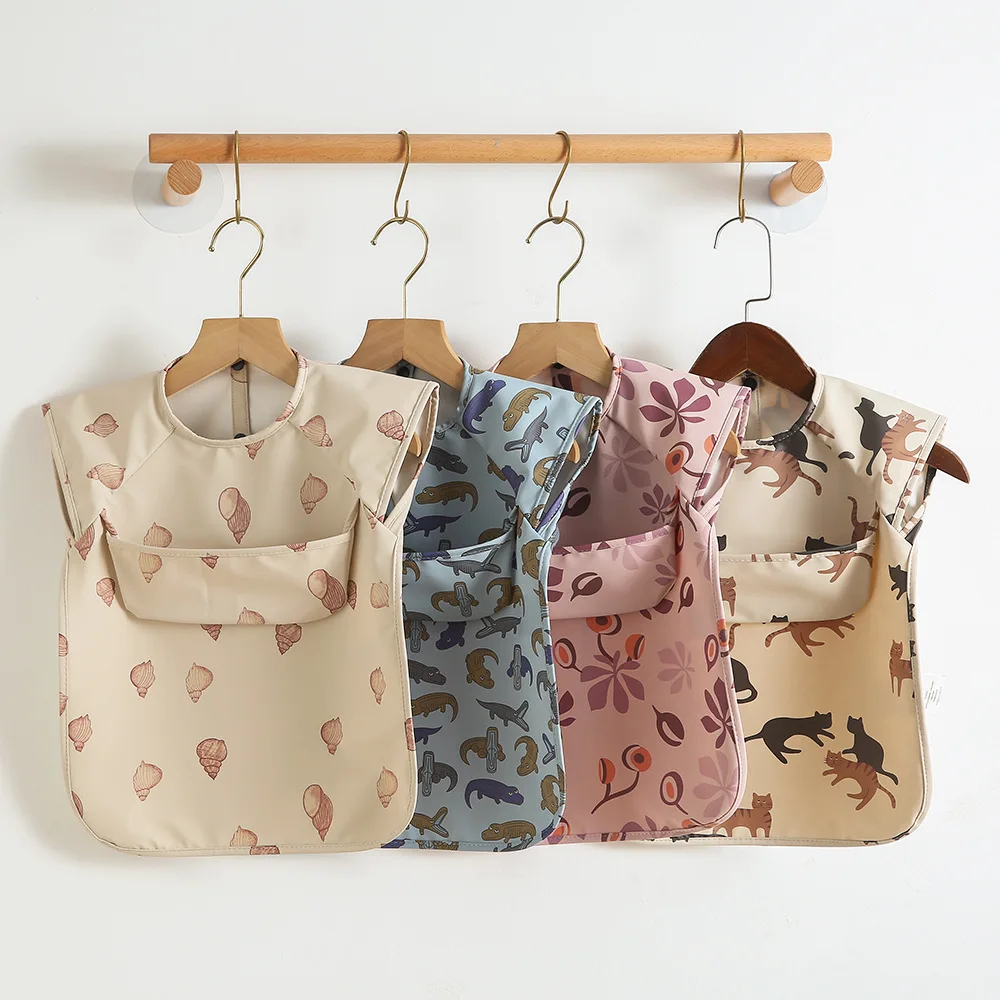 TikTOK Custom Printed Solid Baby Bib Waterproof Solid Print PU Feeding Bib with Pocket short Sleeve Child Apron Smock